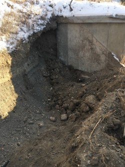 Excavation from pump house to expose buried water line