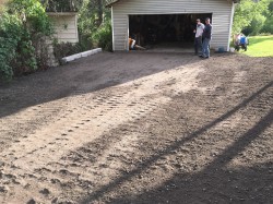 Driveway brought up to grade and capped with gravel road mix